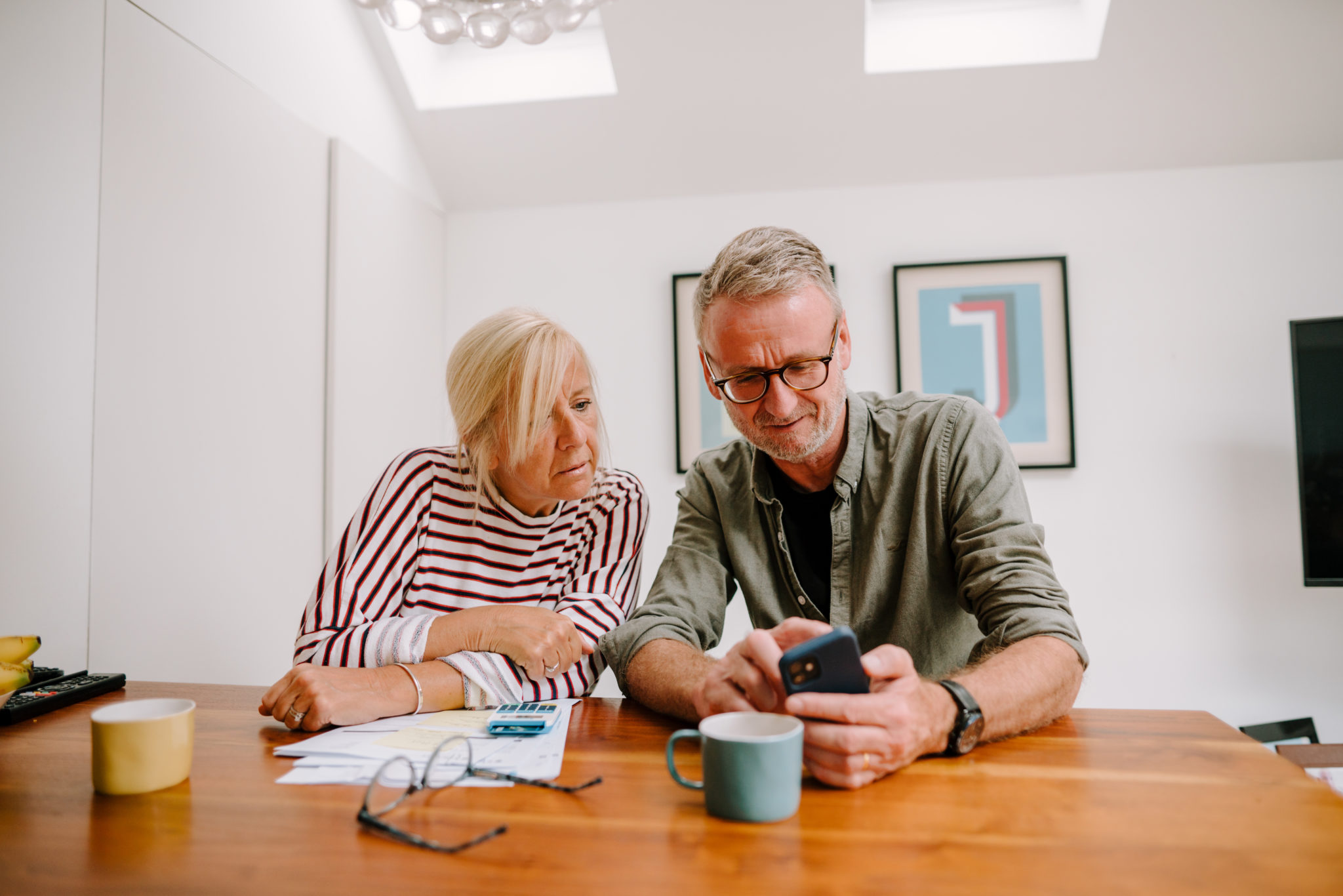 two people looking at a phone